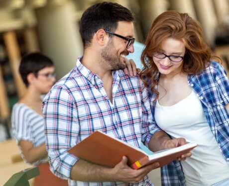 Education friendship people concept. Group of happy students learning together in college library