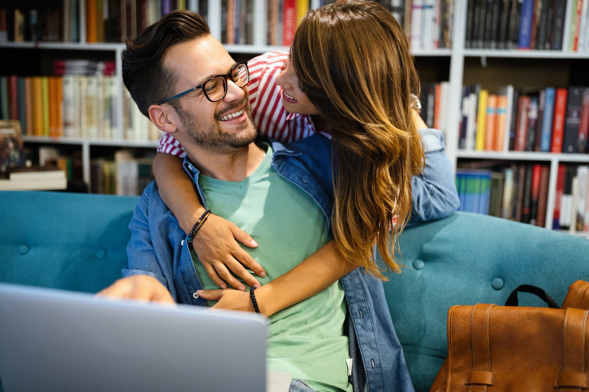 Students are studying together in library. Couple, study, technology, education love concept